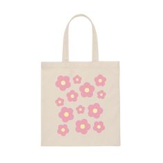 a bag with pink and yellow flowers on the front, sitting against a white background