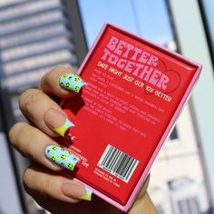 a person holding up a book in their hand with the words better together on it