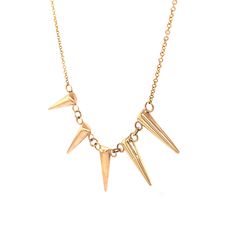 This edgy chain necklace features spike pendants in 14 karat yellow gold. Set on a classic 16 inch chain necklace, five golden spikes dangle in perfect symmetry. For lovers of hardware with a little elegance, this piece has a youthful fashion sense in 14K yellow gold! Perfect Symmetry, Golden Spike, Spike Necklace, Metal Shop, Shop Engagement Rings, Gold Set, For Lovers, Fashion Sense, Shop Necklaces