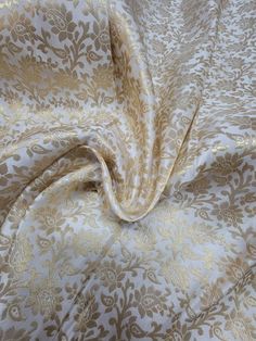 an image of a gold and white fabric