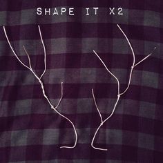 the back of a purple and black checkered shirt with white thread on it that says shape it x2