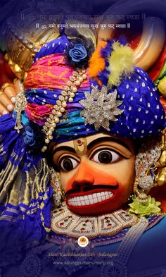 a colorful mask with an elaborate headdress on it's face and the words happy