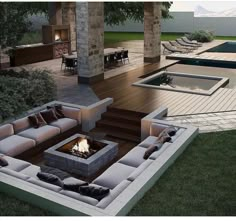 an outdoor living area with couches and fire pit