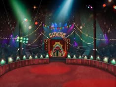 the circus stage is lit up with bright lights and red carpeted area for people to sit on