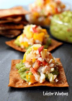 three tortilla chips with guacamole and salsa in the middle on a table