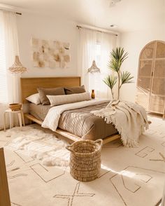 a bed room with a neatly made bed and a basket on the floor next to it