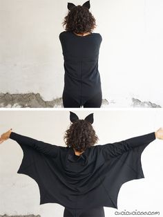 the back of a woman wearing a bat costume