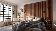 a bedroom with wood paneling on the wall and bed in front of large windows