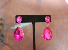 Pink Rhinestone Drop Earrings, Pink Drop Earrings With Rhinestones, Pink Crystal Earrings For Party, Elegant Pink Teardrop Earrings For Party, Pink Teardrop Earrings For Party, Pink Rhinestone Party Earrings, Pink Dangle Jewelry For Party, Pink Crystal Drop Earrings For Party, Glamorous Pink Party Jewelry