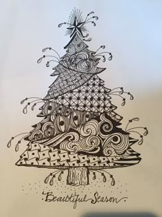 a drawing of a christmas tree with the words beautiful season written on it's side