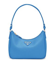 Prada’s timeless bags are some of the most coveted in fashion, with legions of celebrities and fashionistas alike sporting Miuccia Prada and Raf Simons’ effortlessly chic pieces. With iterations like this leather shoulder bag, a clean silhouette showcases elegance in abundance and is finished with the Italian brand’s triangular logo attached to the front. Sport it by day or by night, making a jaw-dropping statement. Monaco F1, Holiday Boutique, Timeless Bags, Bags Prada, Luxurious Life, Prada Saffiano, Miuccia Prada, Fancy Bags, My Bags