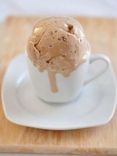 an ice cream sundae on a white saucer