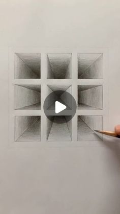 someone is drawing a square with pencils