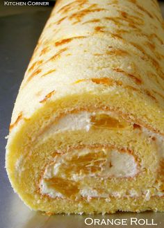 an orange roll is cut in half and ready to be eaten with text overlay