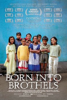 a group of children standing next to each other in front of a blue wall with the words born into brothers on it