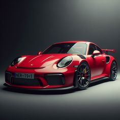 a red sports car parked in a dark room