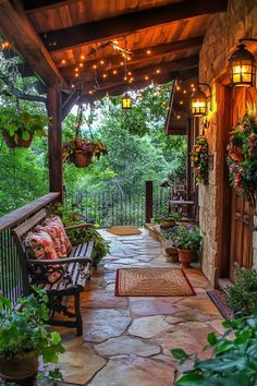 a wooden bench sitting on top of a stone covered walkway next to a lush green forest