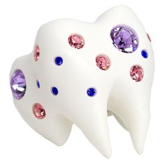 Sugar, spice and everything sparkly. The Sweet Tooth Ring is a lifelike chunky tooth embellished with three different sizes of crystals in violet, pink, and sapphire, each placed individually by hand. This chonky ceramic finished tooth sits on a solid sterling silver band engraved with our signature logo and "you are loved" phrase. Origin story: The Sweet Tooth crawled out of an abandoned candy wrapper found on the street. Toxic trait: Only drinks diet coke. Tooth Ring, Tooth Enamel, Mlp Oc, Anti Fashion, Candy Wrapper, Origin Story, Gold Rings Jewelry, Magical Jewelry, Candy Wrappers