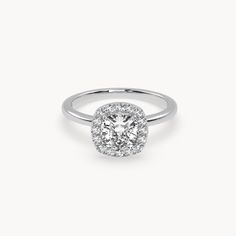 a cushion cut diamond ring with halos