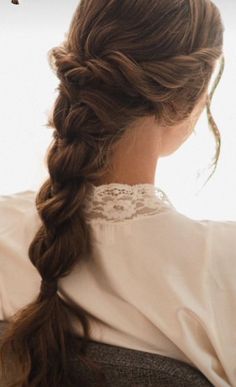 a woman with long hair in a braid