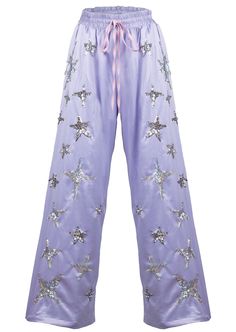 Bring some magic to your wardrobe with our Lilac Stardust Silky Lounge Pants. Made with soft dove satin, these wide leg pants feature hand-beaded galaxies of holographic and silver stars. Each star is carefully hand-embroidered, guaranteed to twinkle in the sunlight. If you want your life to have more magic in it- you can start with your clothes! Galaxy Outfit, Headpiece Accessories, Mermaid Lagoon, Character Clothing, Land For Sale, Silver Stars, Lounge Pants, Stardust, Skirt Pants