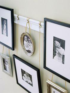 three frames hanging on the wall with pictures attached to them