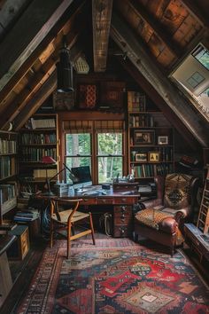 an attic office with lots of books and furniture