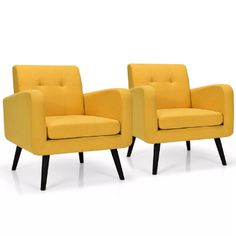 two yellow chairs sitting next to each other