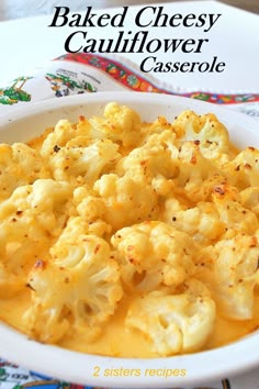 baked cheesy cauliflower casserole in a white bowl