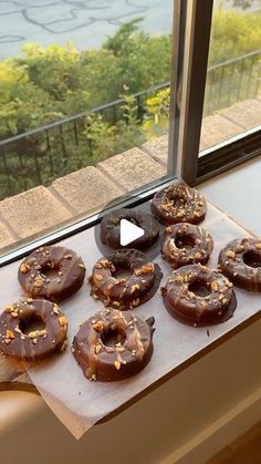 there are many donuts on the window sill