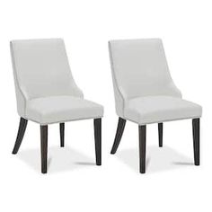 two white chairs sitting next to each other