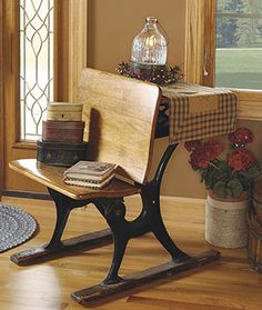 a wooden rocking chair sitting on top of a hard wood floor