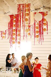 a group of people standing around a table