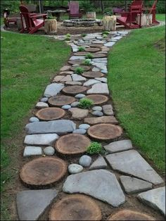 a stone path made out of logs with chairs in the background