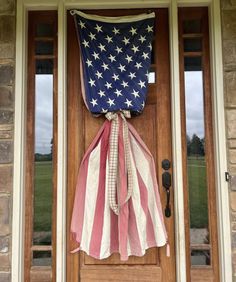 an american flag hanging on the front door