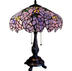 a stained glass lamp on a wooden stand