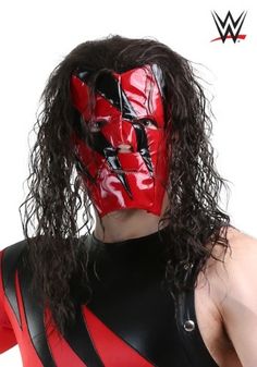 a man with long hair wearing a red and black wrestling mask on top of his head