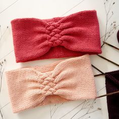 two knitted headbands on top of each other, one with a knot