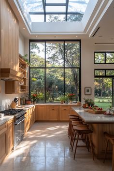 an open kitchen with lots of counter space and wooden cabinets, along with skylights