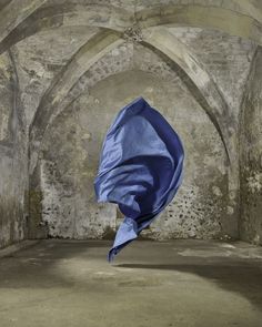 a blue cloth is flying in the air