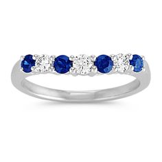 a white gold ring with blue sapphires and diamonds