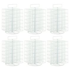 six white wire baskets are stacked on top of each other