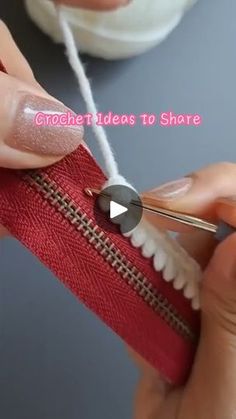 a woman is using scissors to thread the zippers on a red bag with text overlay that reads, crochet videos to share