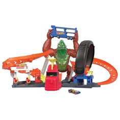 an assortment of toys including cars, trucks and monster figures are shown in this image