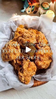 fried chicken in a basket with the words make it at home 101th century popcorn holshots