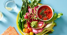 a plate full of fresh vegetables and dip