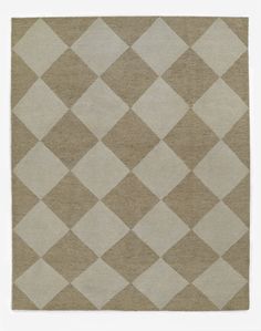 a beige and white rug with squares on the bottom in different sizes, shapes and colors