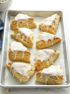 scones with white icing on a baking sheet