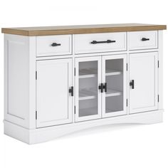 the sideboard has two doors and three drawers on one side, with an oak top