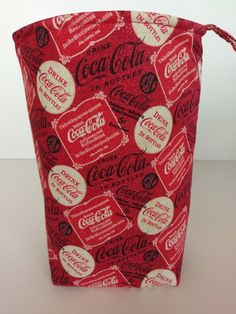 a red and white bag with coca cola on it